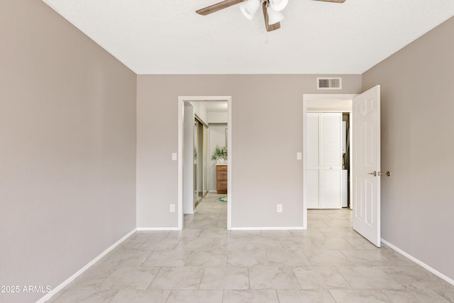 unfurnished bedroom featuring ceiling fan