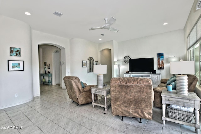 tiled living room featuring ceiling fan