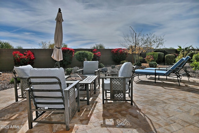 view of patio with a fire pit