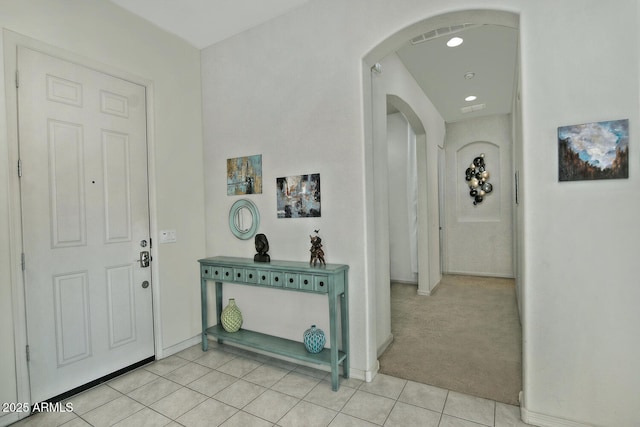 foyer featuring light tile patterned floors