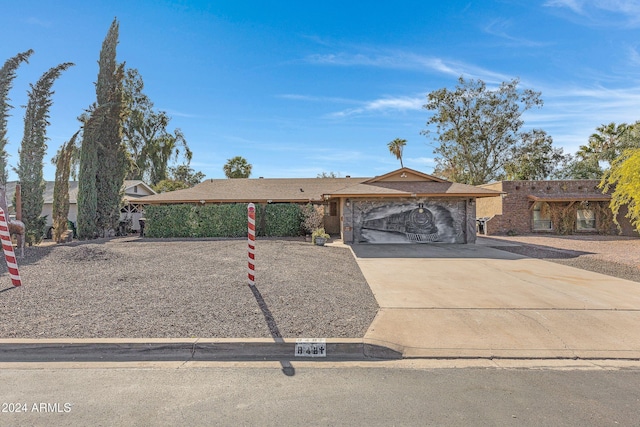 single story home featuring a garage