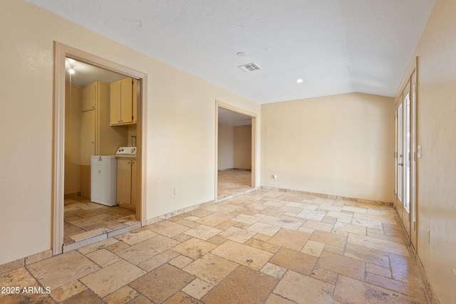 848 S Revolta Cir, Mesa, AZ 85208 - unfurnished room with washer / clothes dryer, stone tile floors, baseboards, and recessed lighting