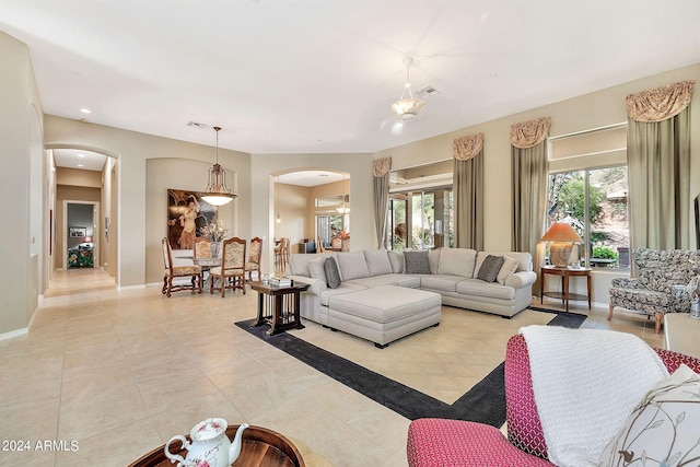 tiled living room with a healthy amount of sunlight