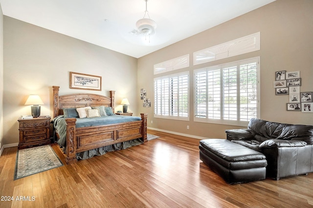 bedroom featuring ceiling fan and hardwood / wood-style flooring