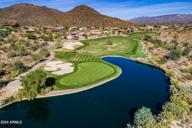 drone / aerial view with a water and mountain view