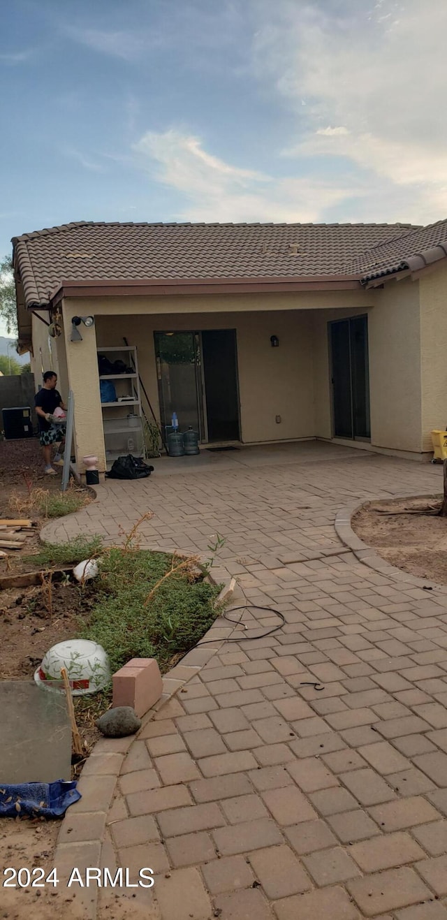 back of property featuring a patio area