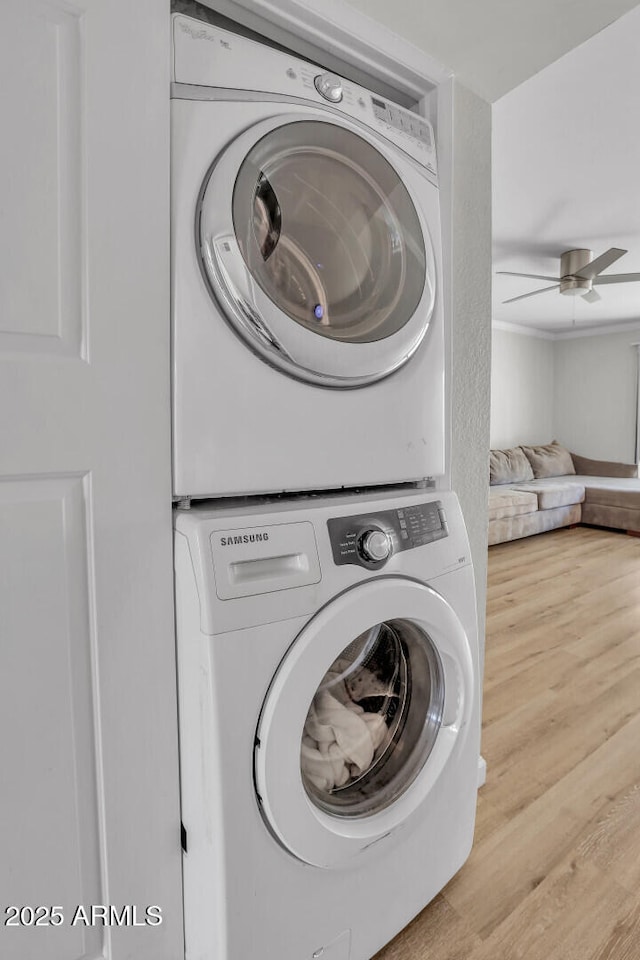 3500 N Hayden Rd Unit 203, Scottsdale, AZ 85251 - laundry area featuring stacked washer / drying machine, wood finished floors, and ceiling fan
