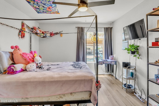 3500 N Hayden Rd Unit 203, Scottsdale, AZ 85251 - bedroom with wood finished floors and a ceiling fan