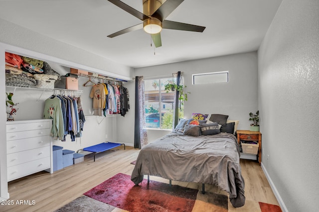 3500 N Hayden Rd Unit 203, Scottsdale, AZ 85251 - bedroom with light wood-type flooring, ceiling fan, and baseboards