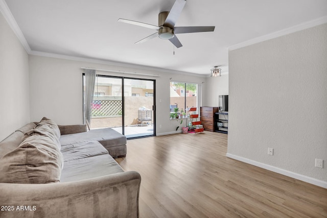 3500 N Hayden Rd Unit 203, Scottsdale, AZ 85251 - living room featuring ornamental molding, ceiling fan, wood finished floors, and baseboards