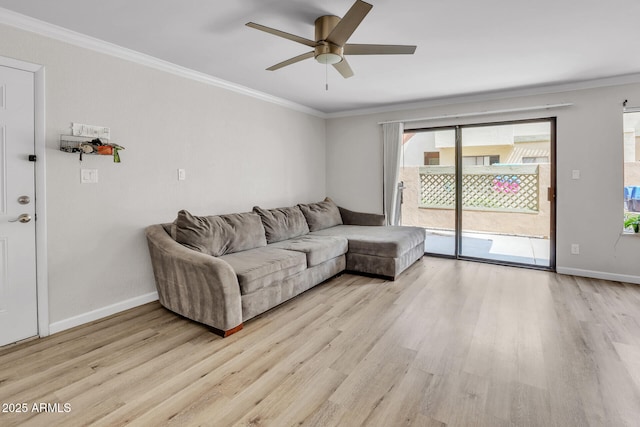 3500 N Hayden Rd Unit 203, Scottsdale, AZ 85251 - living area featuring light wood-style floors, ceiling fan, healthy amount of natural light, ornamental molding, and baseboards