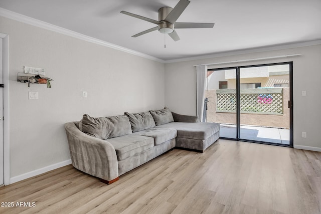 3500 N Hayden Rd Unit 203, Scottsdale, AZ 85251 - living area featuring crown molding, light wood-type flooring, baseboards, and ceiling fan