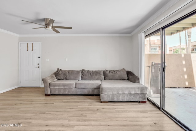 3500 N Hayden Rd Unit 203, Scottsdale, AZ 85251 - living area featuring ornamental molding, ceiling fan, light wood-style flooring, and baseboards