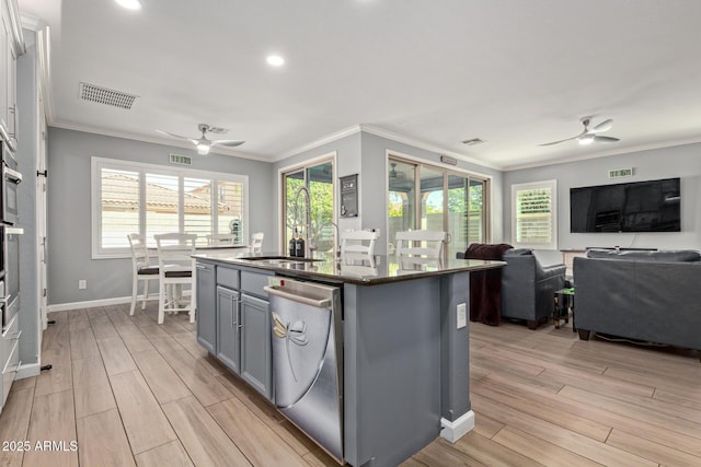 kitchen featuring dishwasher, a ceiling fan, visible vents, and gray cabinetry