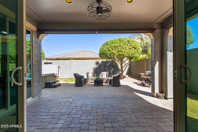 view of patio / terrace with a fire pit and a fenced backyard