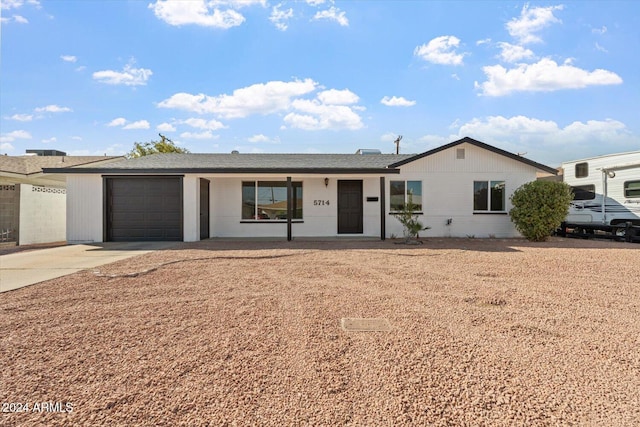 ranch-style home featuring a garage