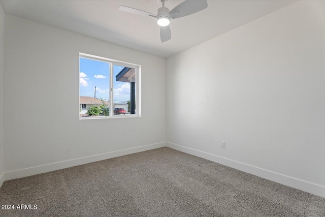 unfurnished room with carpet flooring and ceiling fan