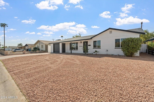 ranch-style home featuring a garage