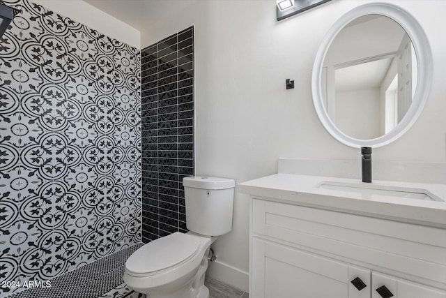 bathroom with vanity, toilet, and walk in shower