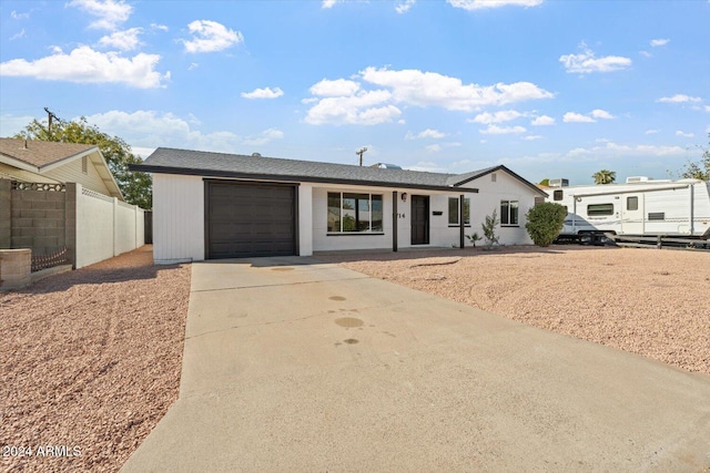 single story home with a garage