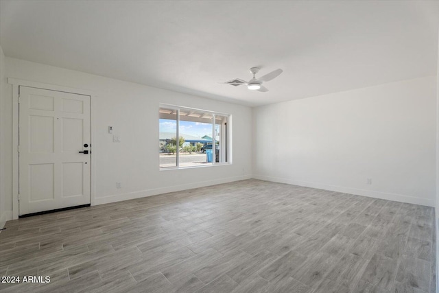 interior space with light hardwood / wood-style floors and ceiling fan