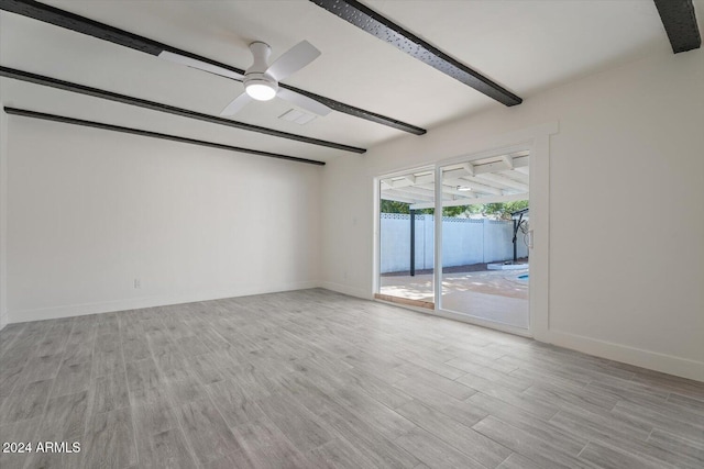 empty room with light hardwood / wood-style flooring and ceiling fan