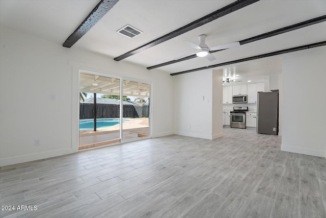 unfurnished living room featuring light hardwood / wood-style floors, beam ceiling, and ceiling fan