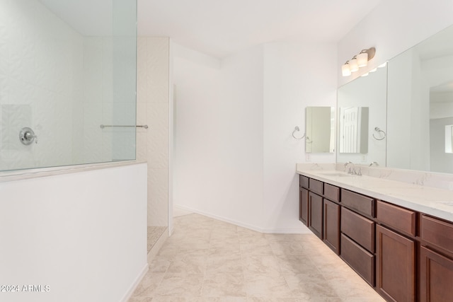 bathroom with vanity and a shower