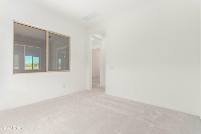 8628 W Solano Dr, Glendale, AZ 85305 - spare room featuring light colored carpet and baseboards