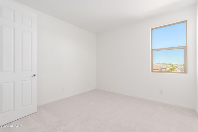 8628 W Solano Dr, Glendale, AZ 85305 - unfurnished room featuring light carpet and baseboards