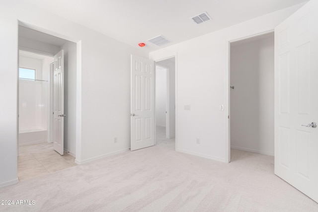 8628 W Solano Dr, Glendale, AZ 85305 - unfurnished bedroom with carpet flooring, baseboards, and ensuite bath