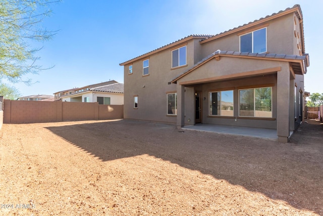 8628 W Solano Dr, Glendale, AZ 85305 - back of property featuring a fenced backyard, a patio, stucco siding, and a tile roof