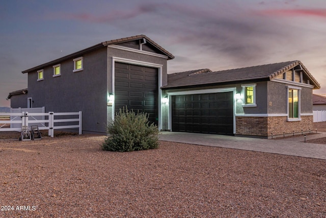 property exterior at dusk with a garage