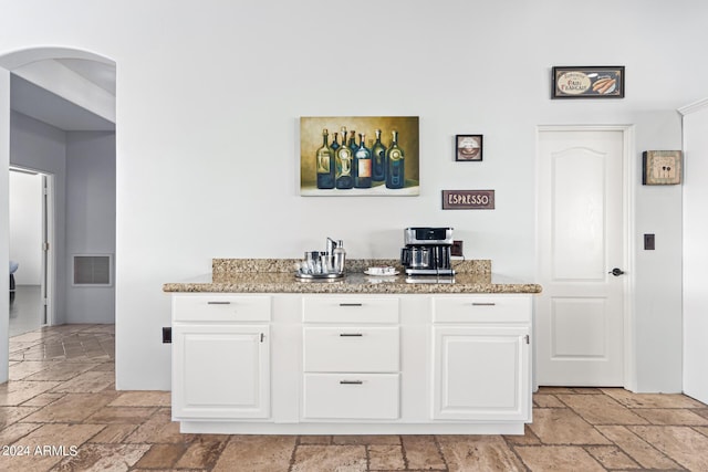 2731 W Desert Ranch Rd, Phoenix, AZ 85086 - bar with stone tile floors and arched walkways