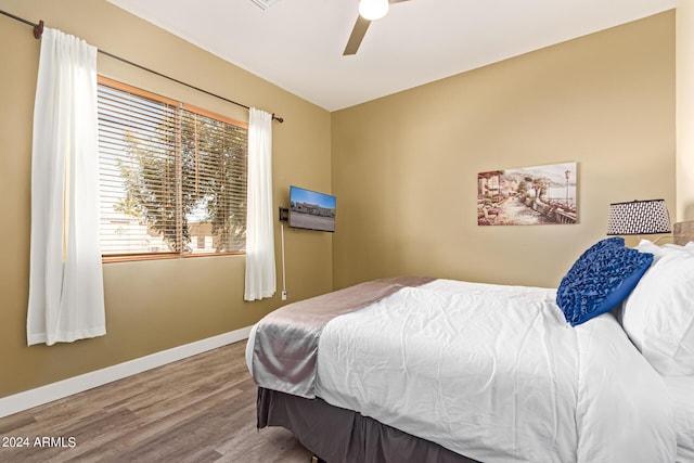 2731 W Desert Ranch Rd, Phoenix, AZ 85086 - bedroom with wood finished floors, baseboards, and a ceiling fan