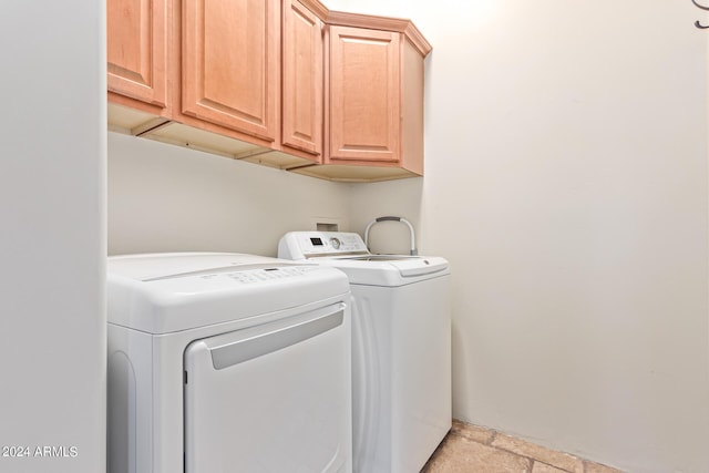 2731 W Desert Ranch Rd, Phoenix, AZ 85086 - washroom with cabinet space, washing machine and dryer, and light stone finish floors