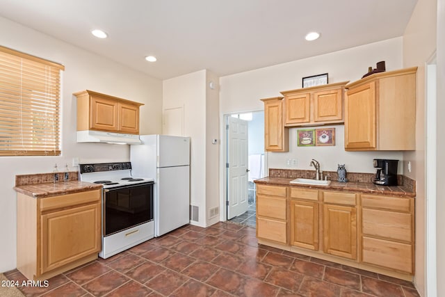 2731 W Desert Ranch Rd, Phoenix, AZ 85086 - kitchen with range with electric stovetop, under cabinet range hood, light brown cabinetry, a sink, and recessed lighting