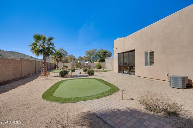 2731 W Desert Ranch Rd, Phoenix, AZ 85086 - fenced backyard with a putting green, central air condition unit, and a patio area