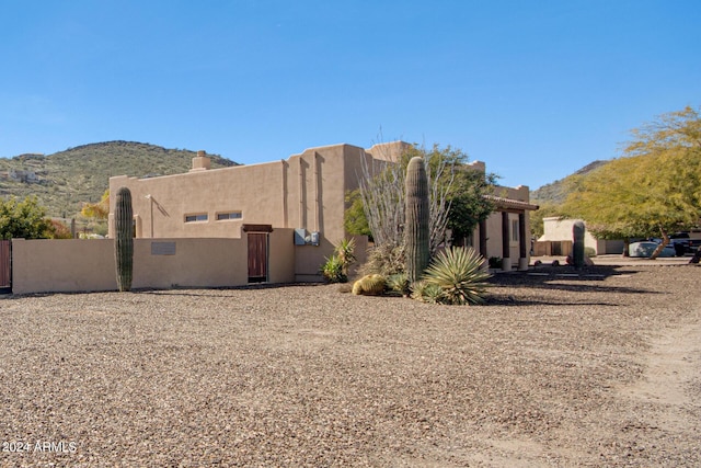 2731 W Desert Ranch Rd, Phoenix, AZ 85086 - back of property featuring a mountain view and stucco siding