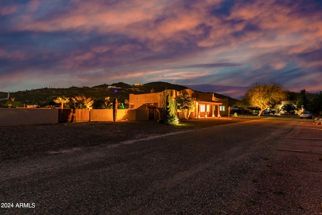 2731 W Desert Ranch Rd, Phoenix, AZ 85086 - adobe home with stucco siding and dirt driveway