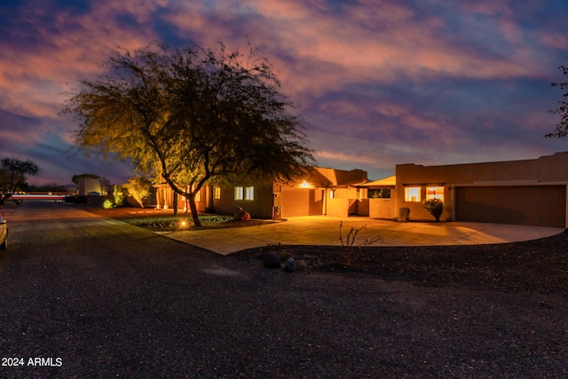 2731 W Desert Ranch Rd, Phoenix, AZ 85086 - view of front facade with a garage, driveway, and stucco siding