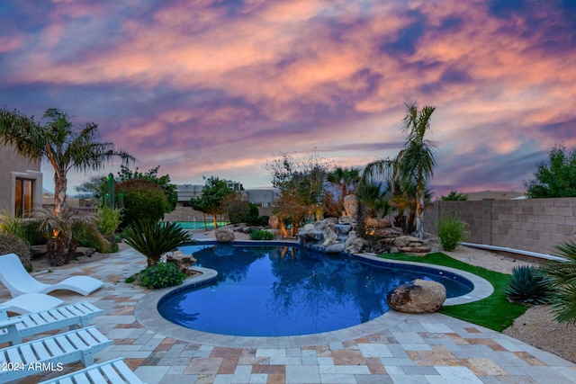 2731 W Desert Ranch Rd, Phoenix, AZ 85086 - pool at dusk with a patio