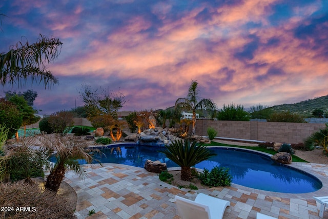 2731 W Desert Ranch Rd, Phoenix, AZ 85086 - pool at dusk with a patio area