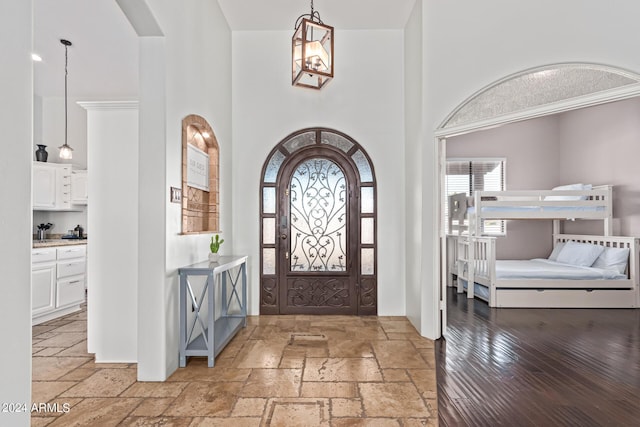 2731 W Desert Ranch Rd, Phoenix, AZ 85086 - entrance foyer featuring a towering ceiling, arched walkways, and stone tile floors