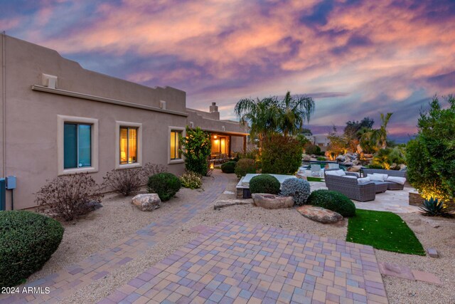 2731 W Desert Ranch Rd, Phoenix, AZ 85086 - patio terrace at dusk with outdoor lounge area and a patio