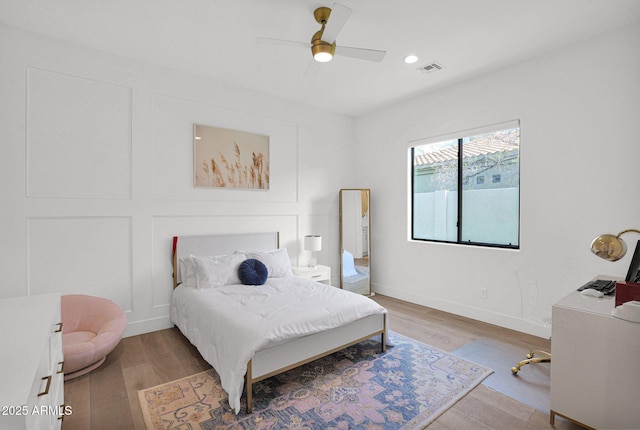 bedroom featuring ceiling fan and light hardwood / wood-style floors