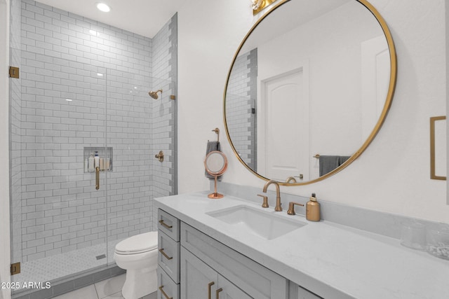 bathroom featuring vanity, tile patterned flooring, a shower with shower door, and toilet