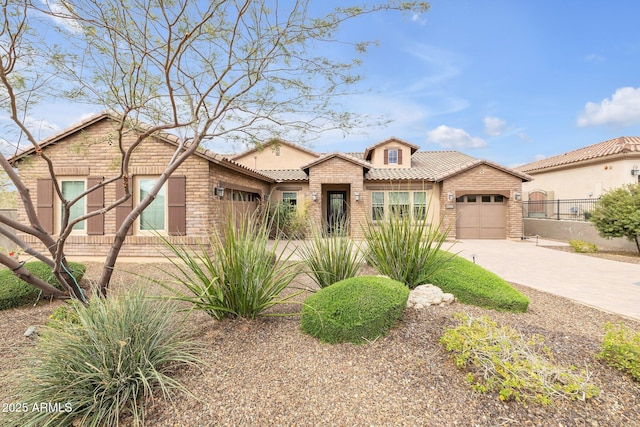10886 N 137th St, Scottsdale, AZ 85259 - view of front of home with concrete driveway, a tiled roof, an attached garage, and stucco siding