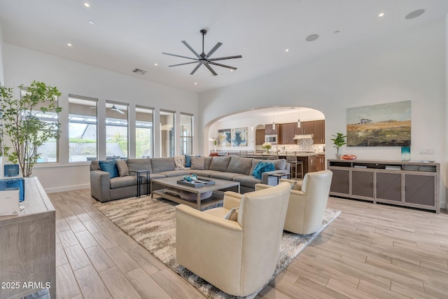 10886 N 137th St, Scottsdale, AZ 85259 - living area with ceiling fan, recessed lighting, arched walkways, and wood finish floors