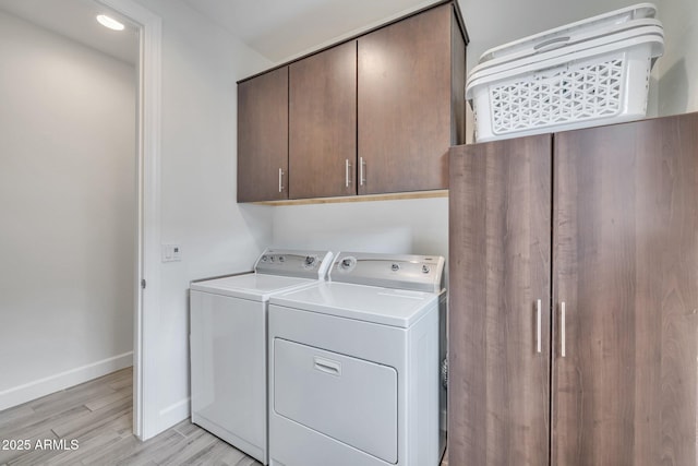 10886 N 137th St, Scottsdale, AZ 85259 - clothes washing area featuring baseboards, cabinet space, light wood-style floors, and independent washer and dryer